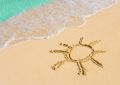 Drawing sun on beach - fototapeta
